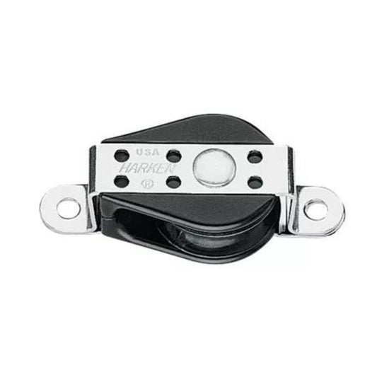 A Harken pulley block with a black rubberized surface and polished silver metal hardware, featuring the Harken brand name and 'USA' engraved on the metal plate.